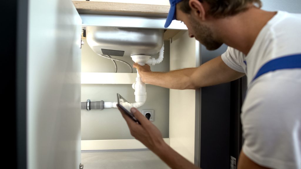 plumber checking water pipes